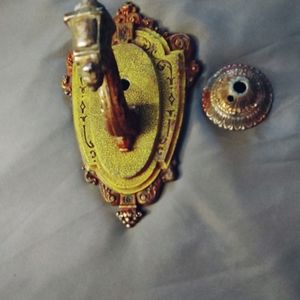 Antique Riddles cast aluminium wall scone